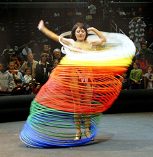 A member of Ringling Bros. and Barnum &|| Bailey Circus keeps 60 hula hoops going at once during her pre-show act March 27, 2008